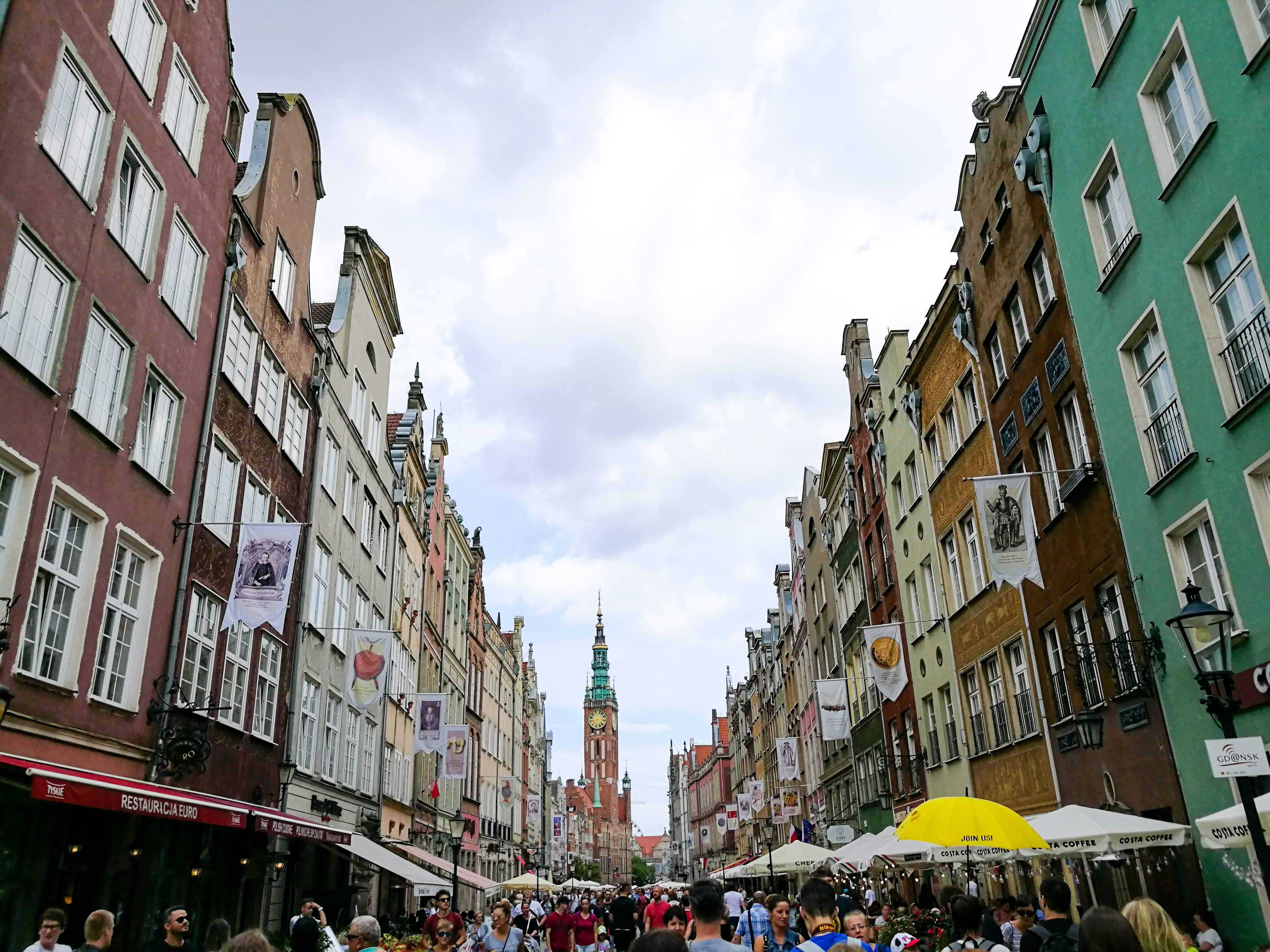Gdansk main square filled with people and umbrellas