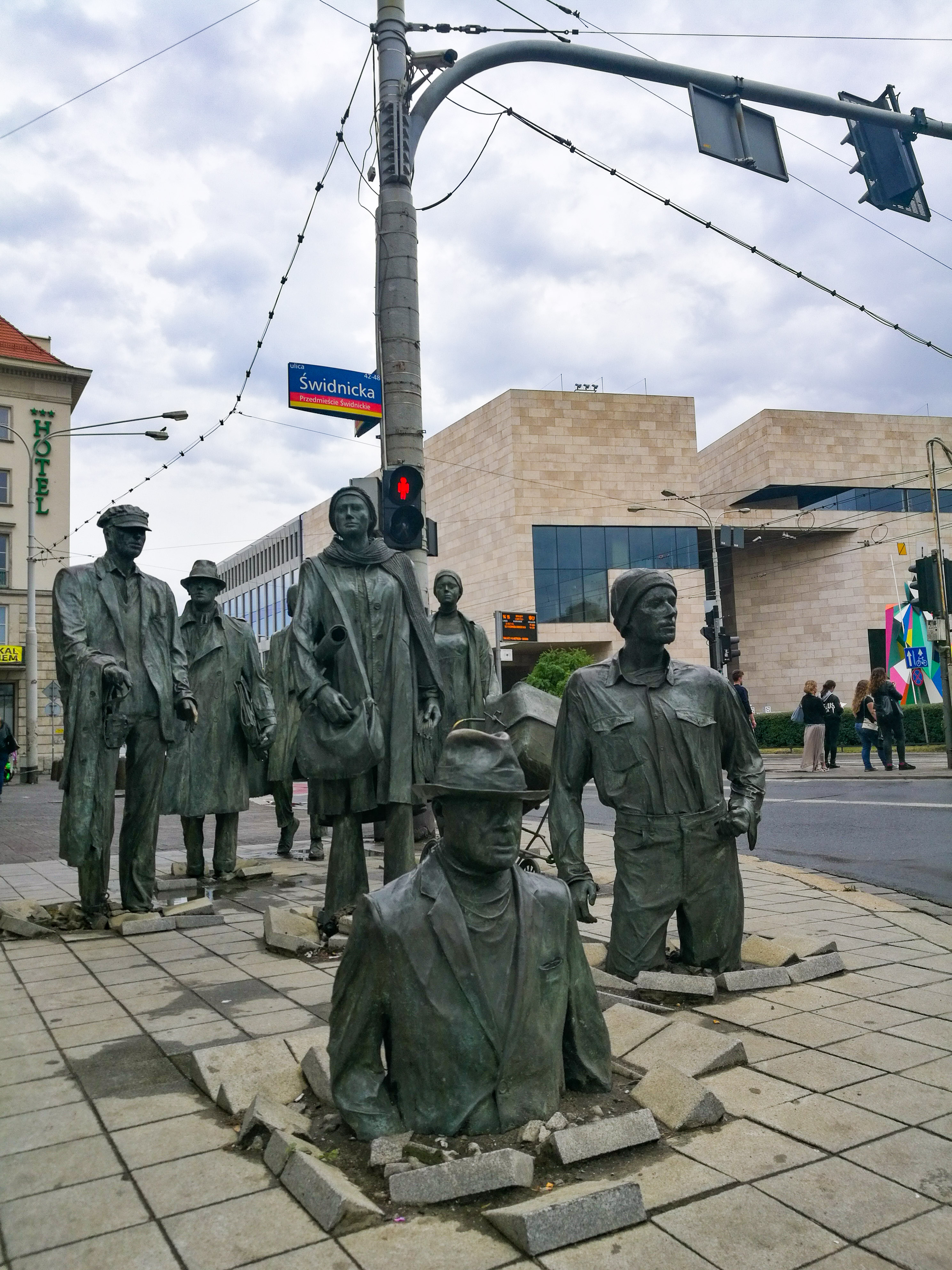 The statues of The Passage on a street in Wroclaw.