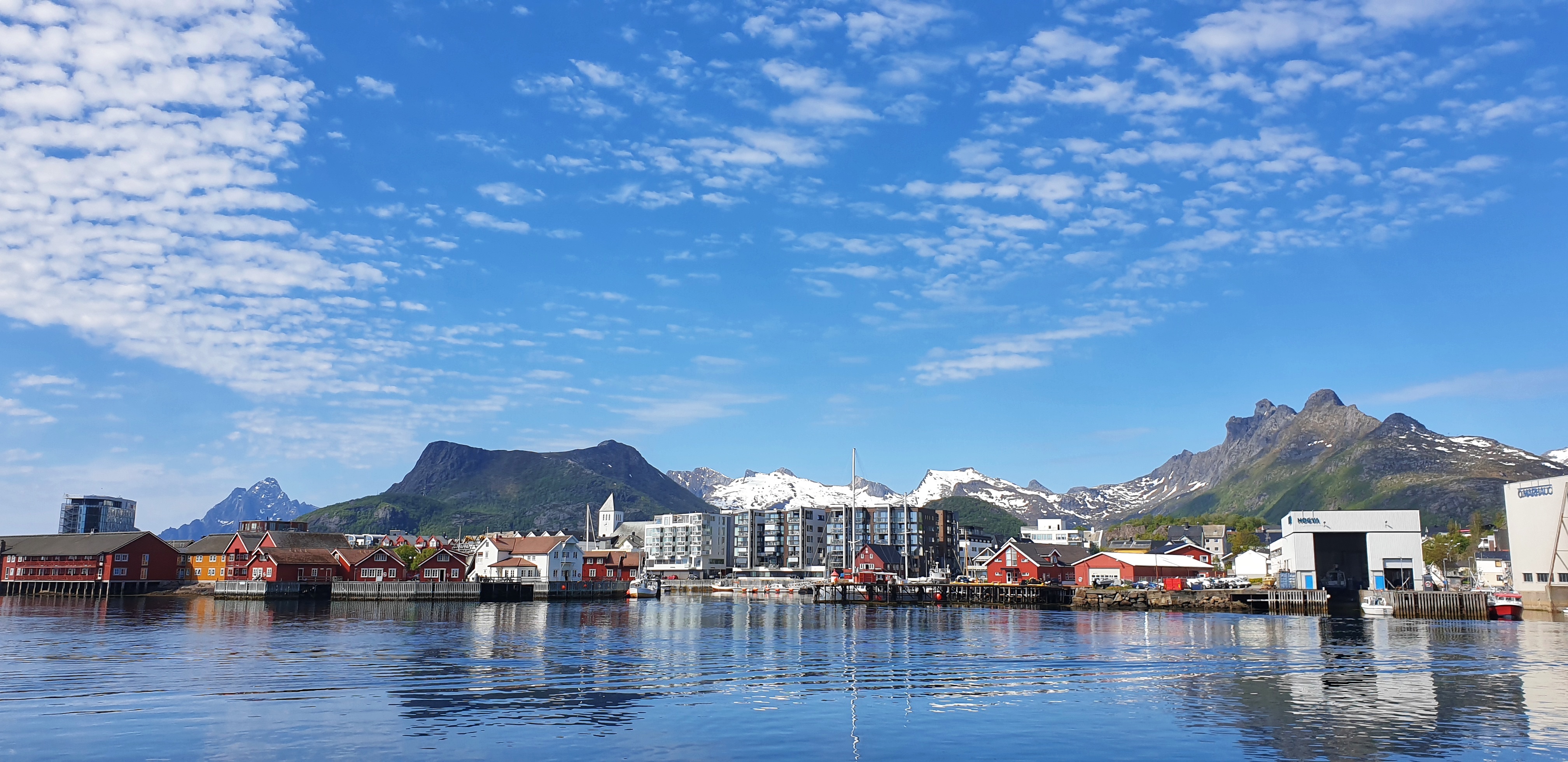 Sunny SvolvÆr with mountains behind.