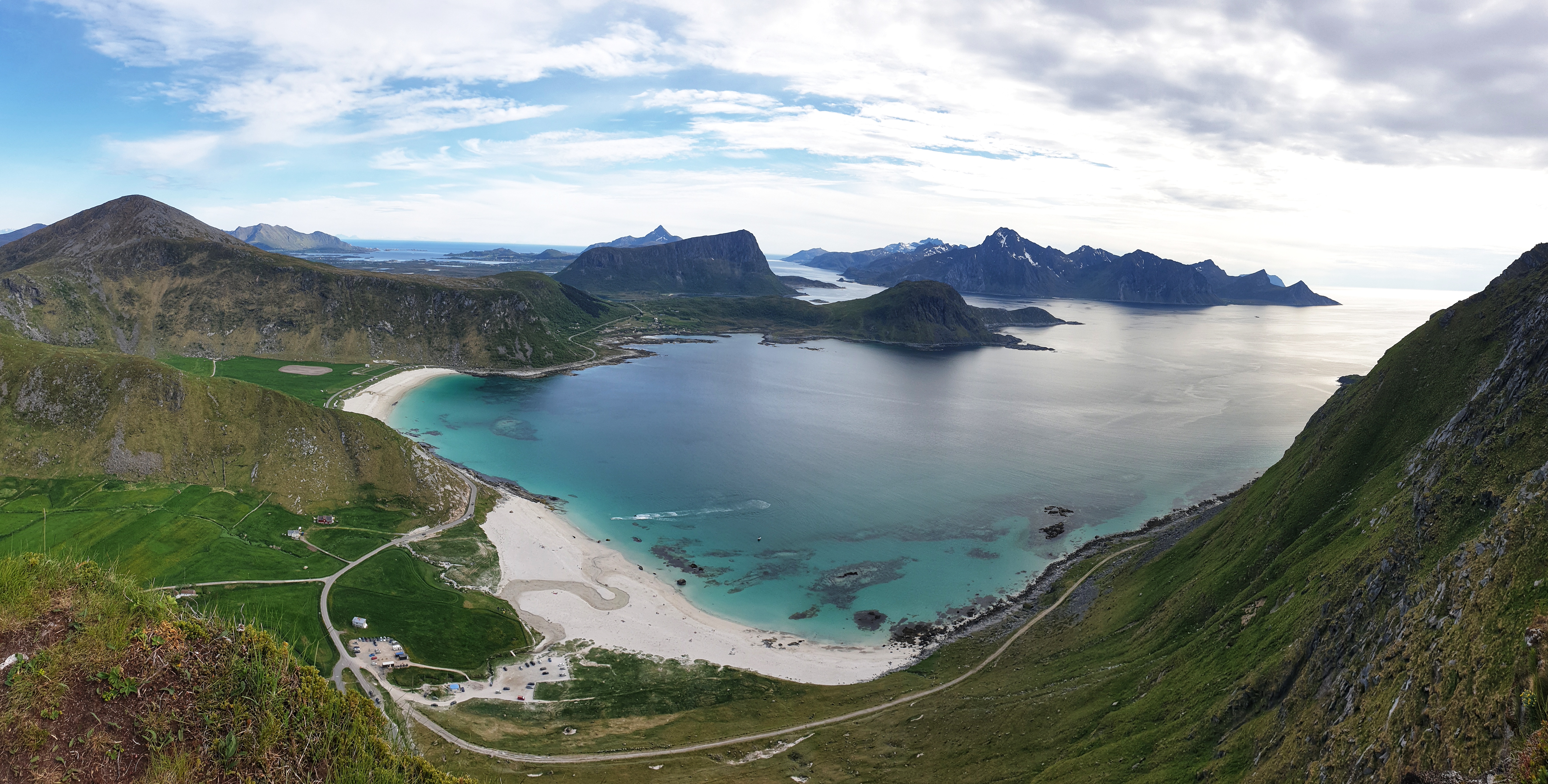 Vie to mountains, beaches and the sea from Mt. Mannen in Lofoten.