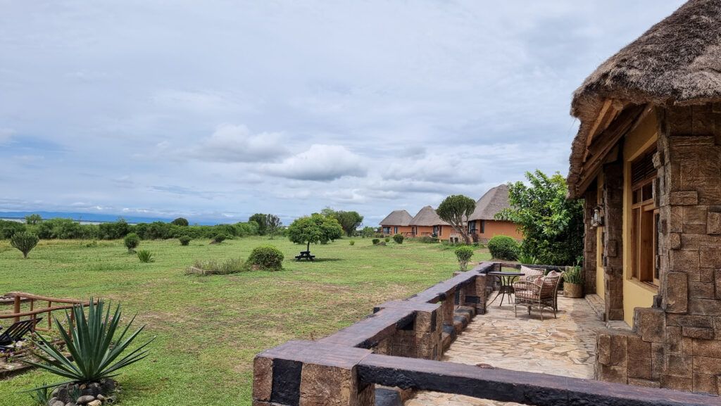 Ihamba Lodge with the row of cottages and wide green garden.