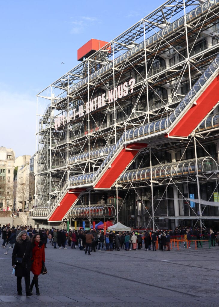 Centre of Pompidou with lots of people in line in front.