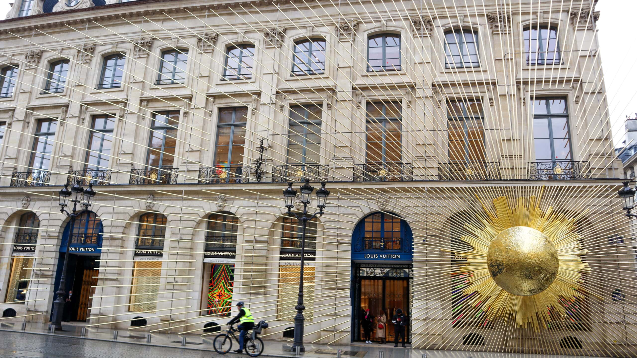 A large sun ornament on Louis Vuitton store in Paris.