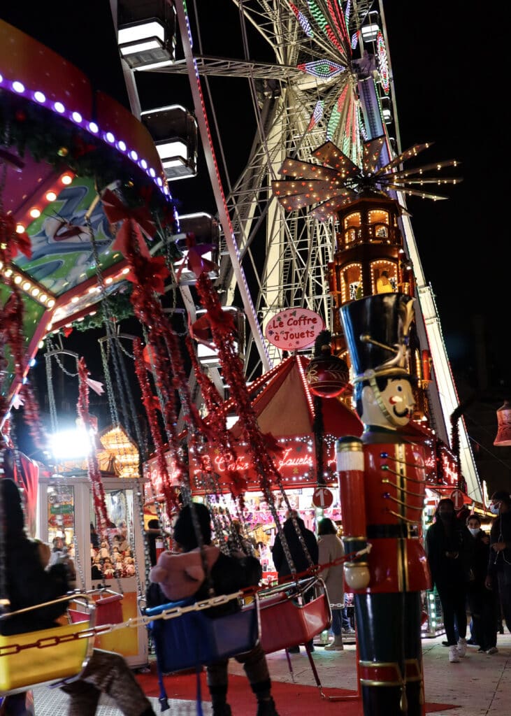 Ferris wheel and tivoli activties for children at Jardin des Tuileries Christmas market.