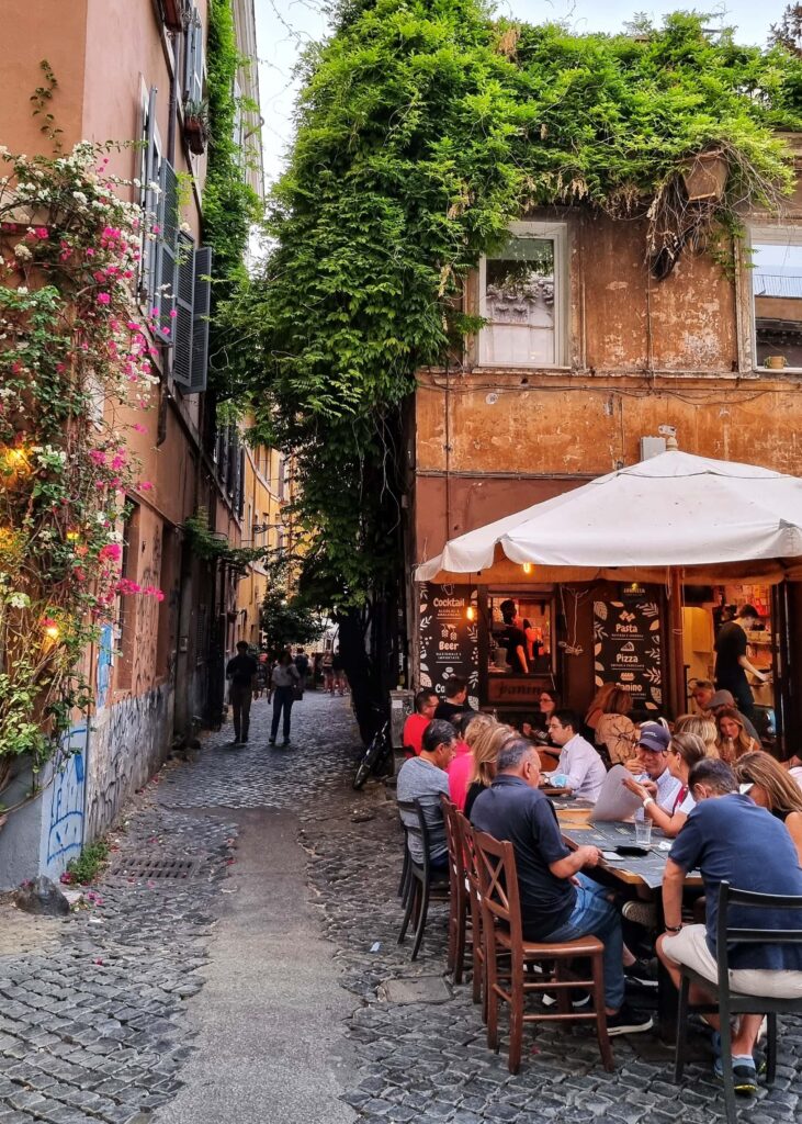 A street restaurant by an alley in Trastevere, Rome.