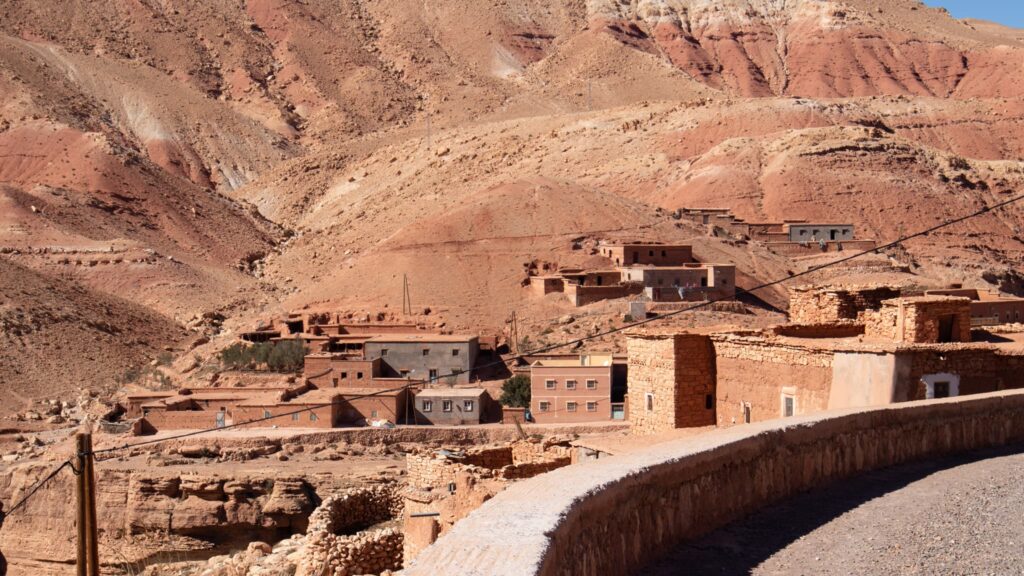 Berber village clinging on to the redish mountain sides.