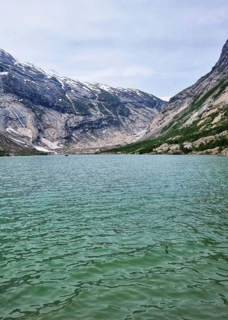 Nigardsbreen glacier seen in the distance. Glacial lake in front.