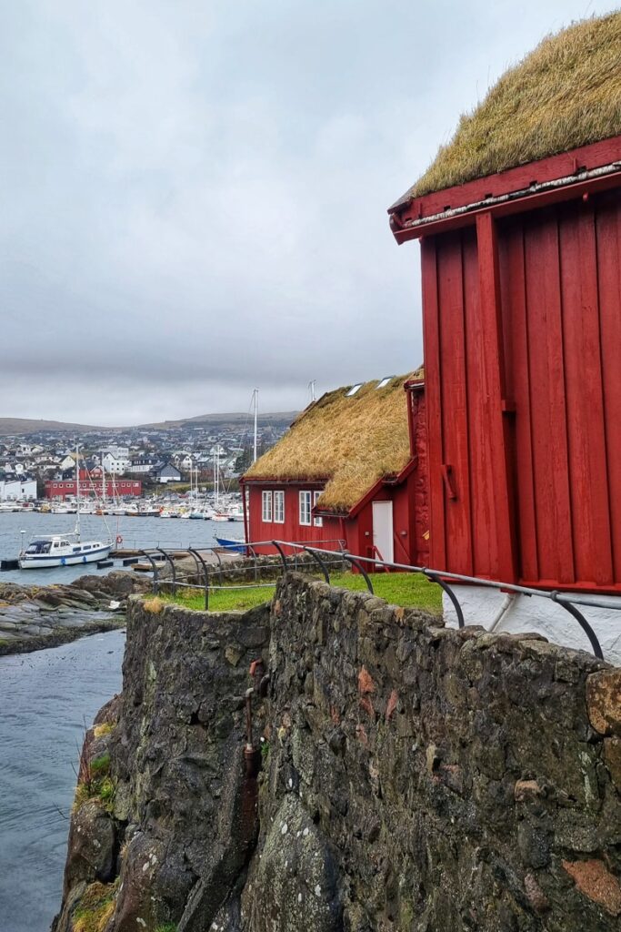 The red buildings at Tinganes with Tórshavn in the background.