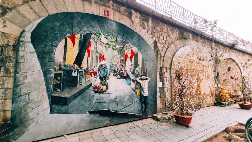 A mural on Phung Hung Street in Hanoi. Bright colours and typical daily lfe scenes.