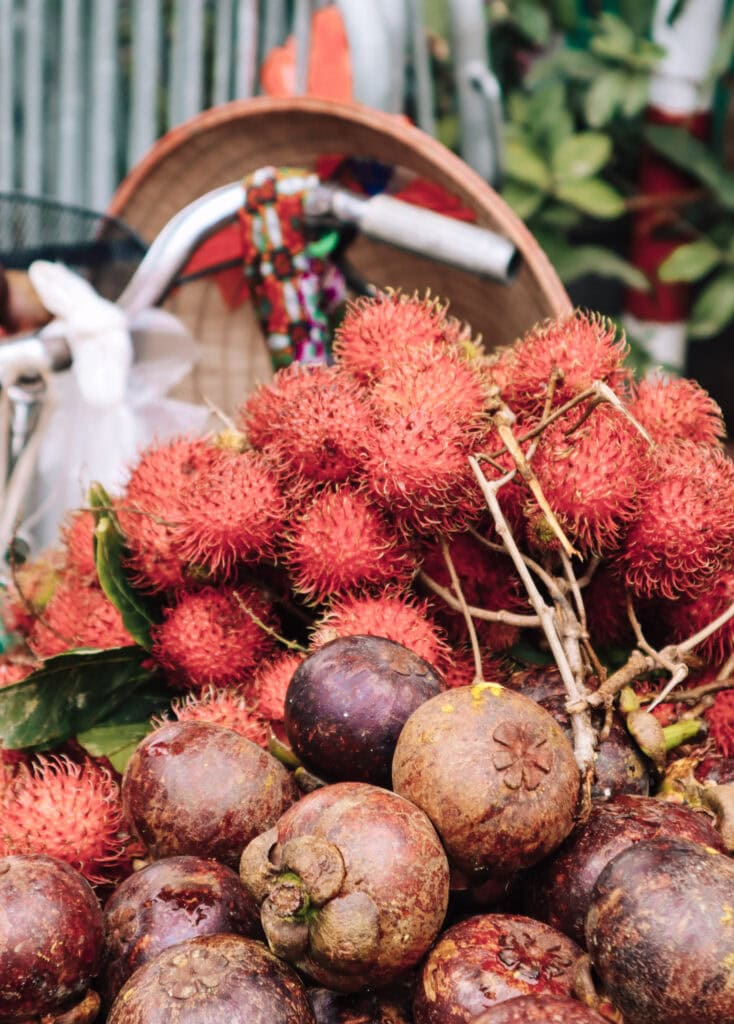 Close-up of a bike with tropical fruit.