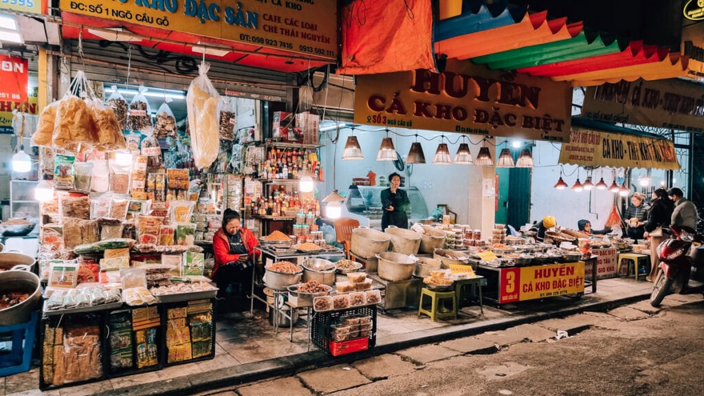 Food market along a street in Hanoi in the evening.