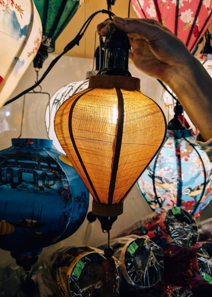Lantern making in Hoi An. My yellow lantern with light inside.