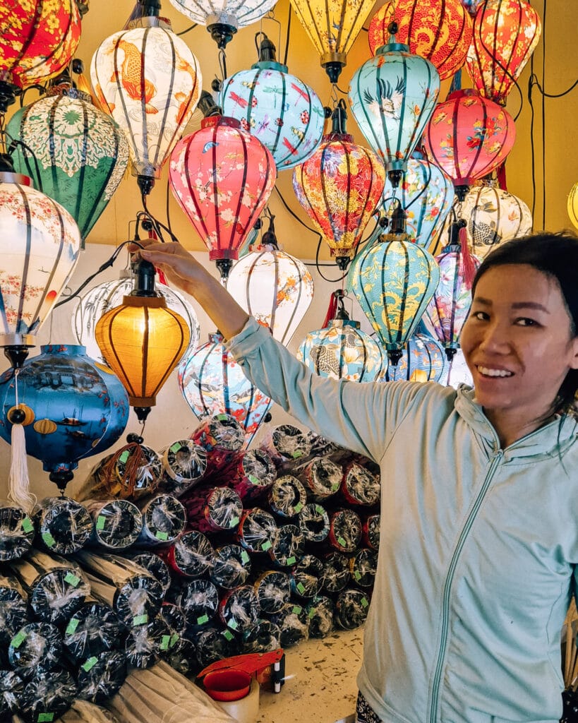 The tutor of a lantern workshop holding my lantern up agains others.