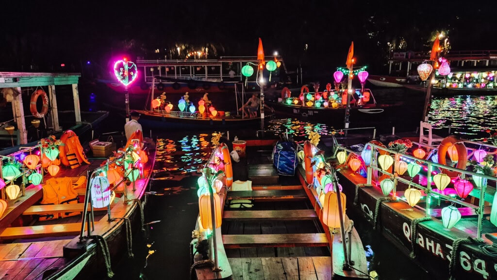 Boats covered in colourful lanterns on Hoi An River.