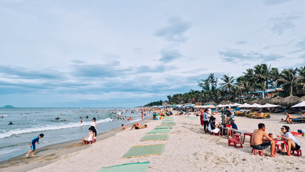 Locals gathering on the beach in the afternoon.
