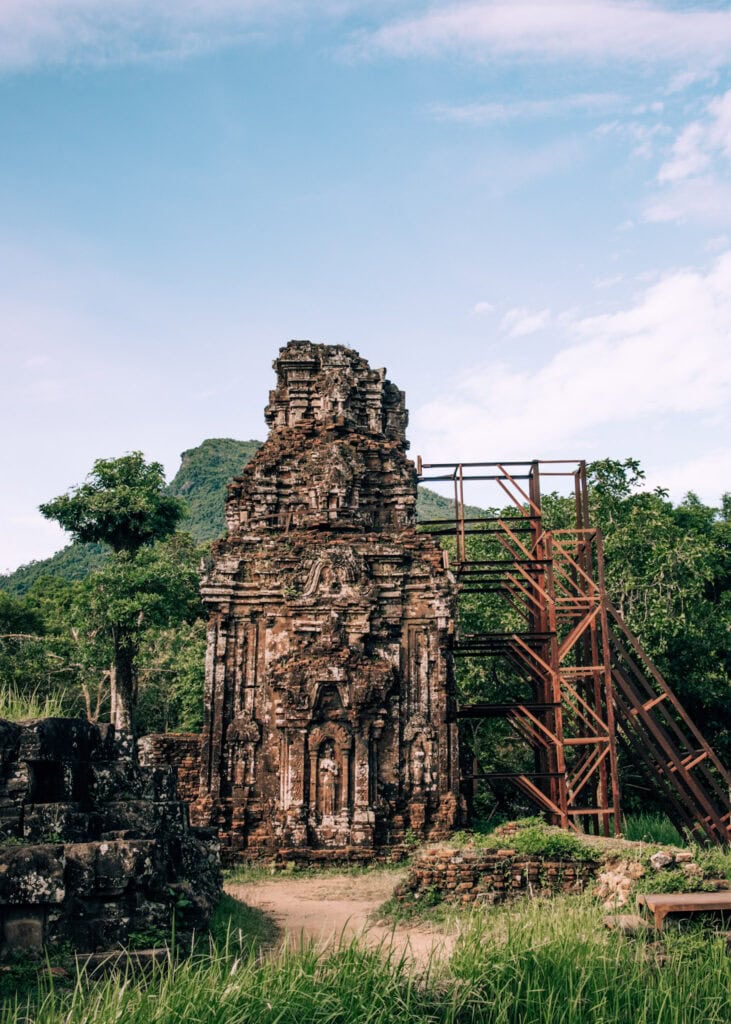 A temple under reconstruction surrounded by lush vegetation at My Son outside of Hoi An.