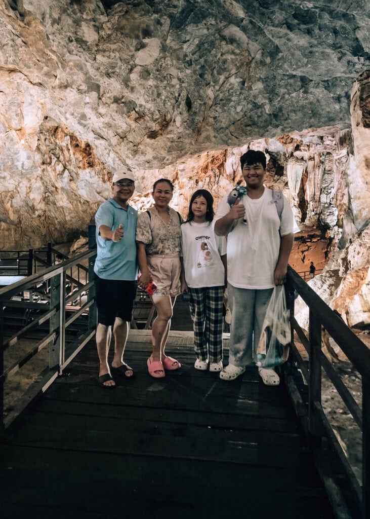 A Vietnamese family posing for the camera inside Paradise Cave.