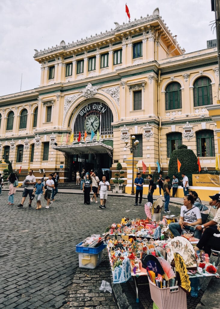 Street vendors sitting outside the Central Post Ofice in Saigon.