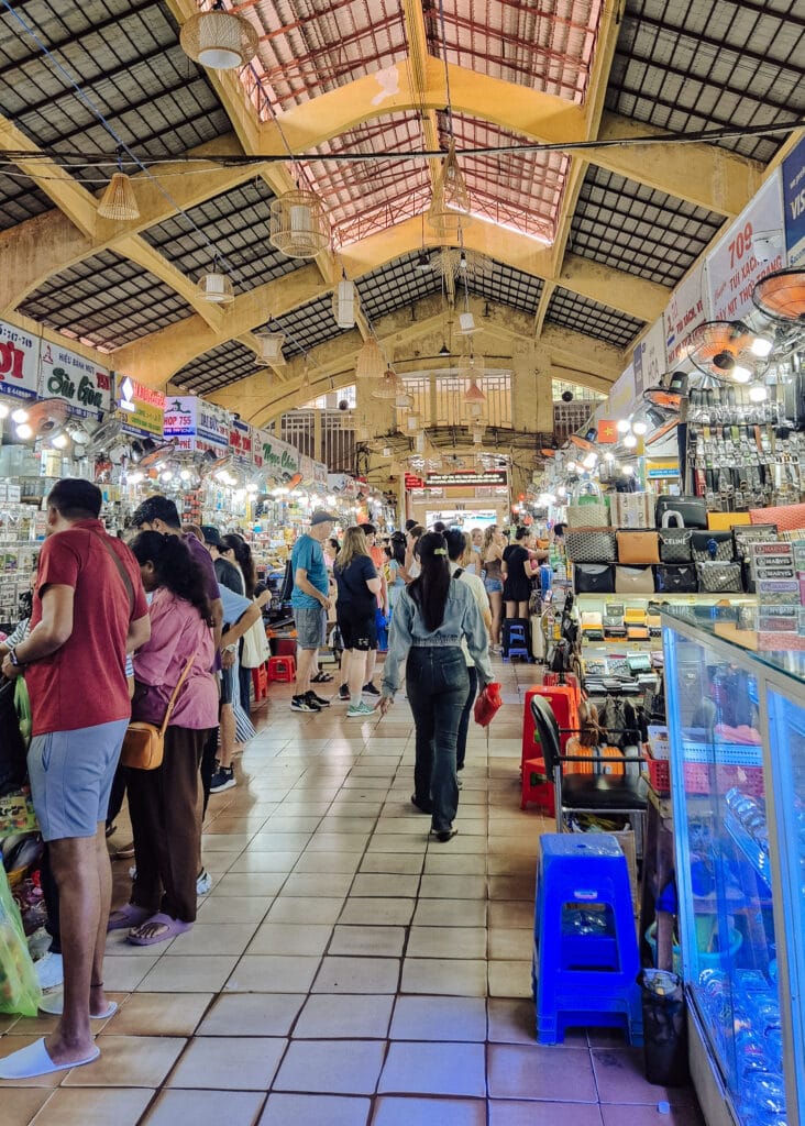 Interior of the Ben Than Market. Poeple browsing for souvenirs.